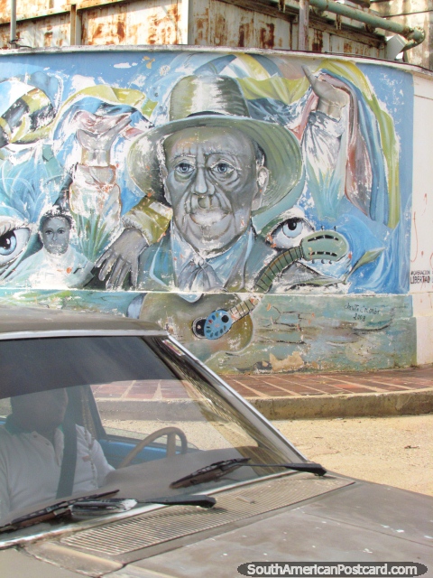 Arte de grafite em Carora, homem com chapéu e violão. (480x640px). Venezuela, América do Sul.