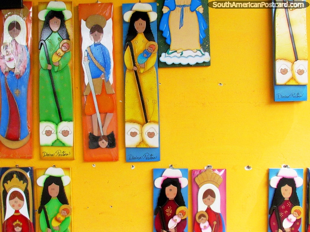 Wall pictures of women holding babies in El Tintorero. (640x480px). Venezuela, South America.