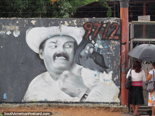 Pintura mural de la pared de un hombre con ave en hombro y 2 mujeres bajo un paraguas, Barquisimeto. (640x480px). Venezuela, Sudamerica.