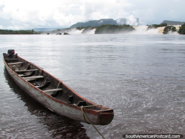 A riverboat at Canaima Lagoon, looking across to the waterfalls. (640x480px). Venezuela, South America.