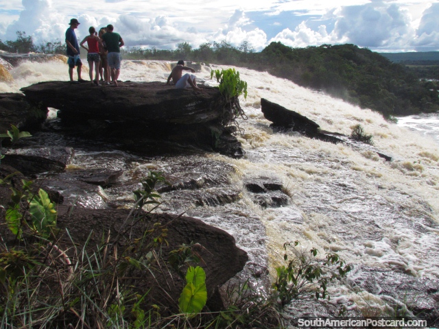 My group taking in the amazing sight of waterfall Salto El Sapo in Canaima. (640x480px). Venezuela, South America.