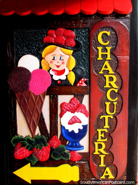 A Charcuteria is a butcher but the sign has icecreams and strawberries, Colonia Tovar. (480x640px). Venezuela, South America.