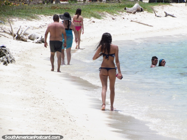 People walking and enjoying the beach and water at Cajo Sombrero, Morrocoy National Park. (640x480px). Venezuela, South America.