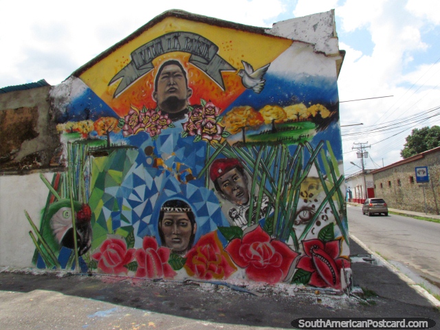 'Viva la Patria', colorful wall mural in Barinas of Chavez, nature and 2 other figures. (640x480px). Venezuela, South America.