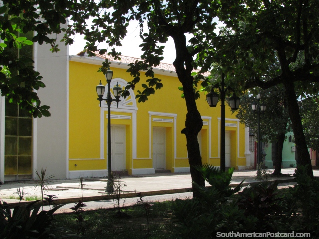 A yellow historical building to the side of Plaza Bolivar in Barinas. (640x480px). Venezuela, South America.