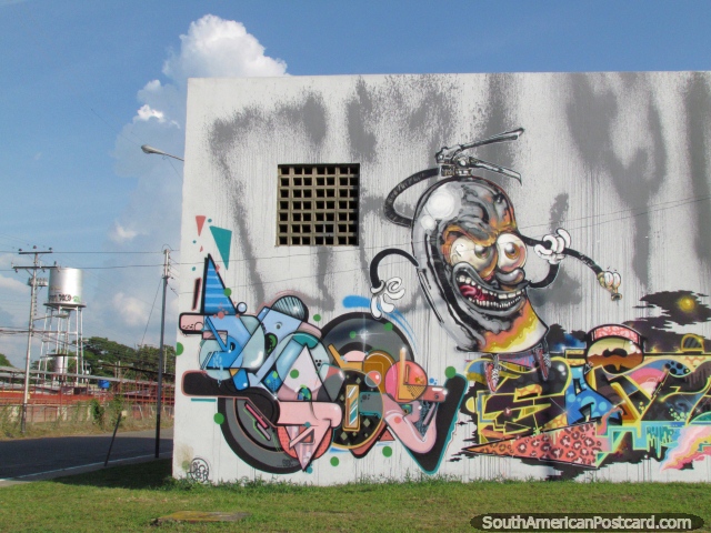 Arte de graffiti del monstruo con ojos redondos y brillantes loco en Barinas. (640x480px). Venezuela, Sudamerica.